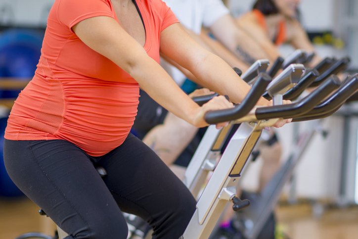 Pregnant woman cycling